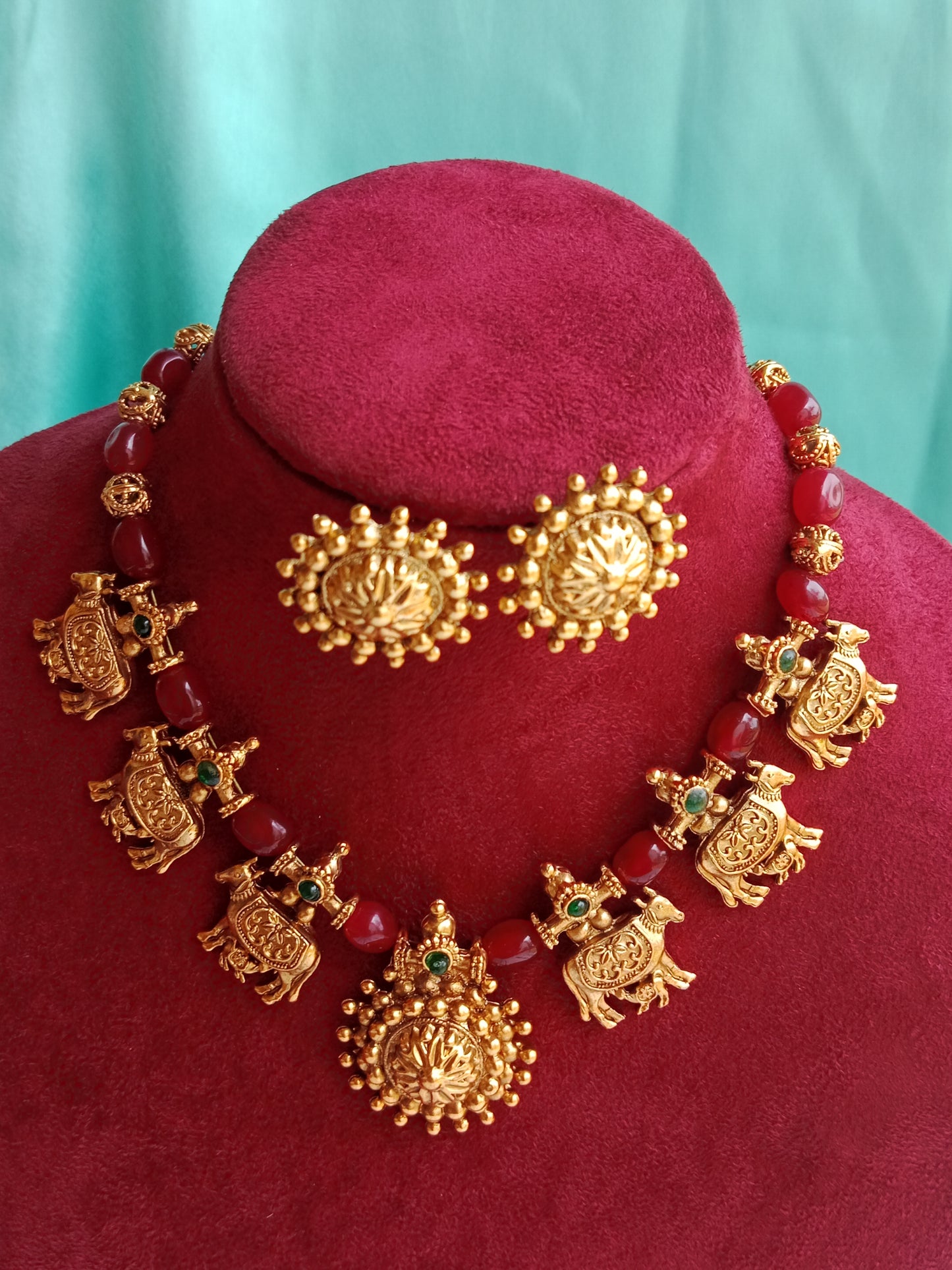 Kamadhenu Antique Gold Temple Necklace Set with Ruby Red Beads & Stud Earrings