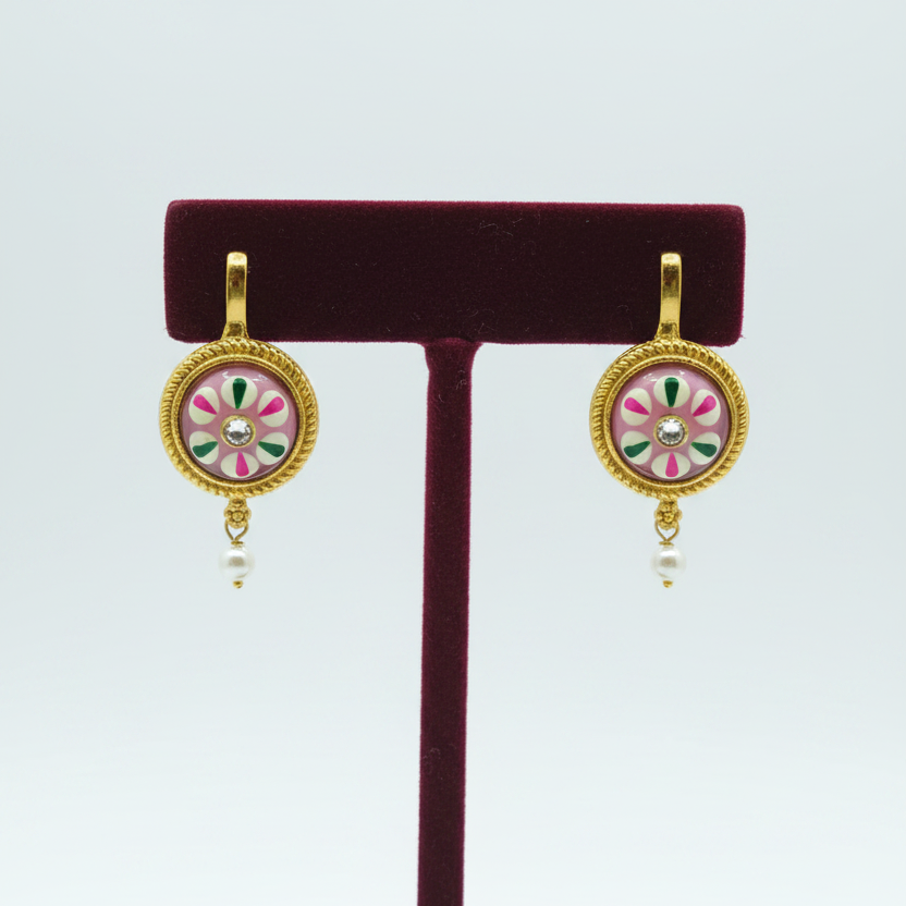 Earrings on burgundy velvet stand