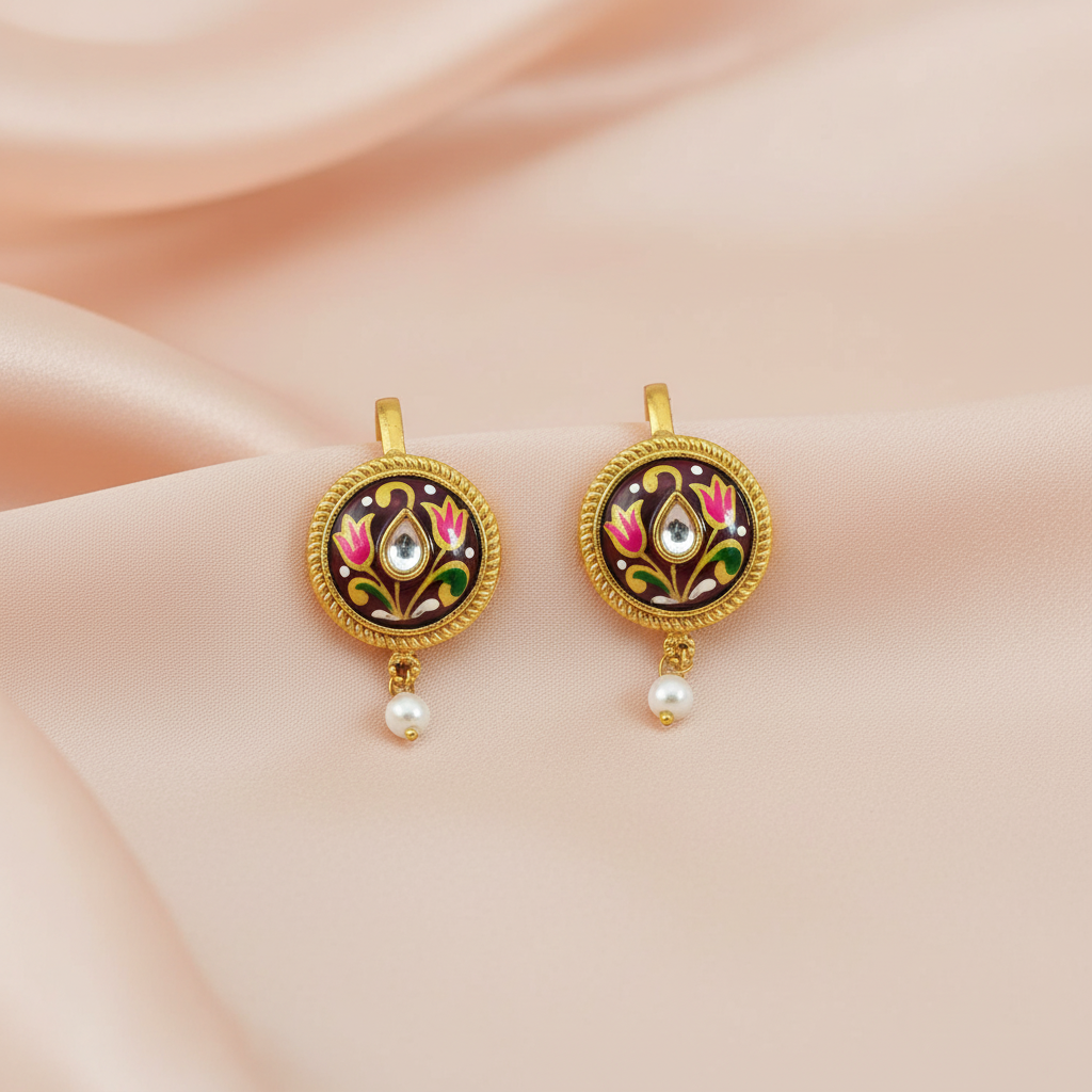 Maroon earrings on blush peach silk with pastel background