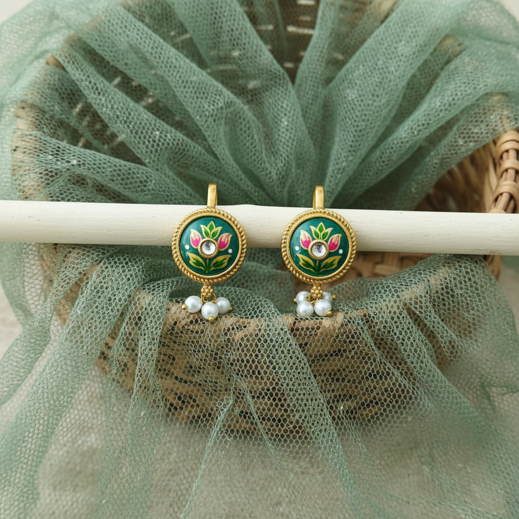 Teal earrings on wooden stick with basket and net cloth